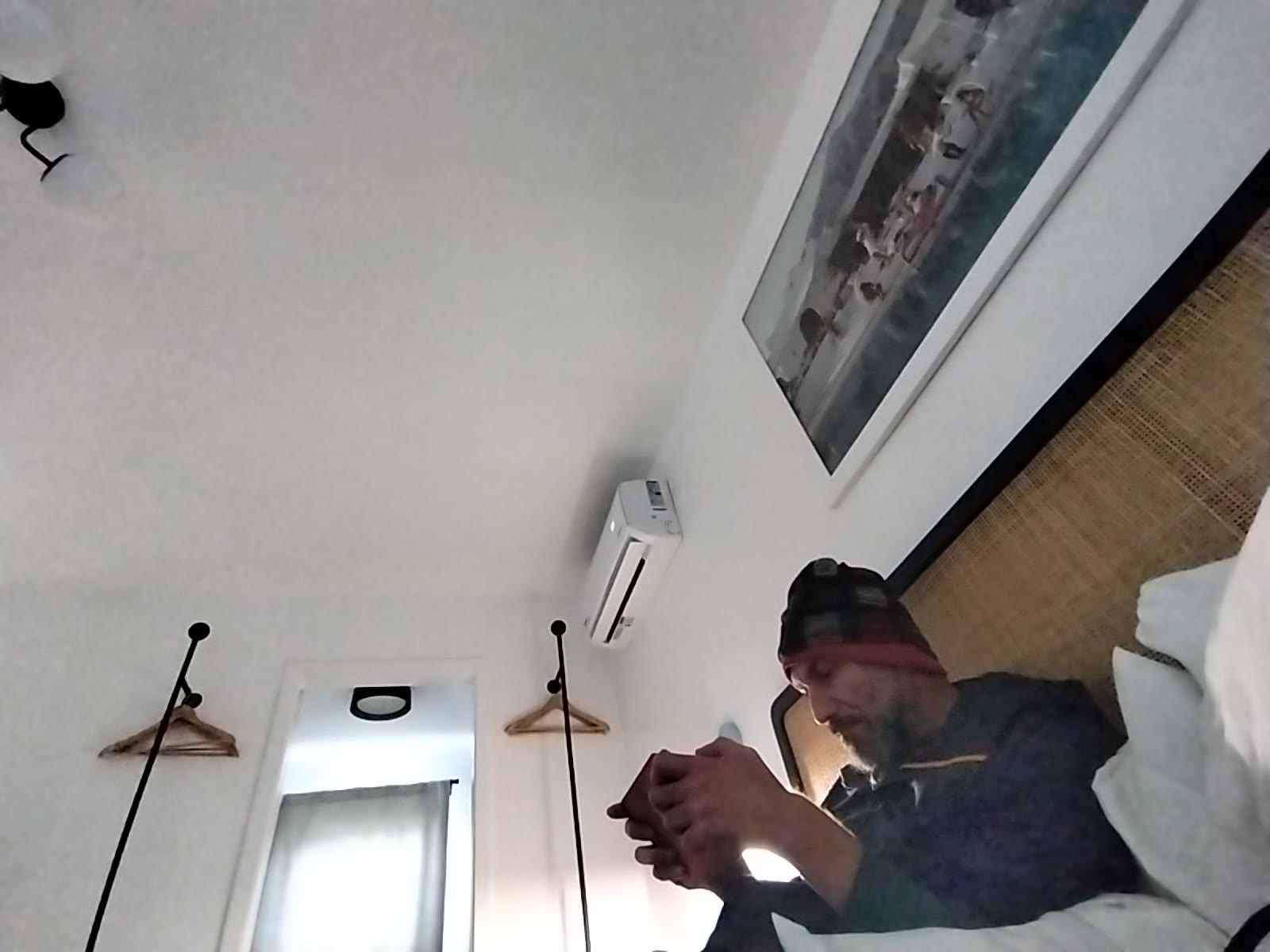 Resting and Checking Phone in Bed